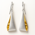 Pair of earrings with gold and silver teardrop design on a white background