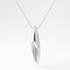 Silver pendant necklace on a white background