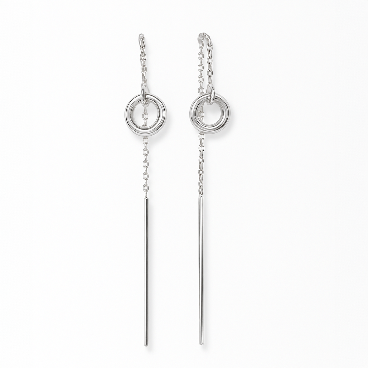 Pair of silver earrings with circular and vertical design on a white background