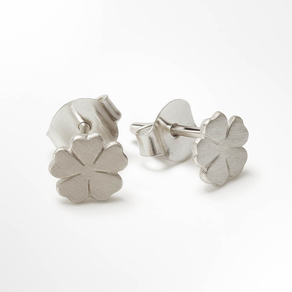 Silver flower earrings on a white background