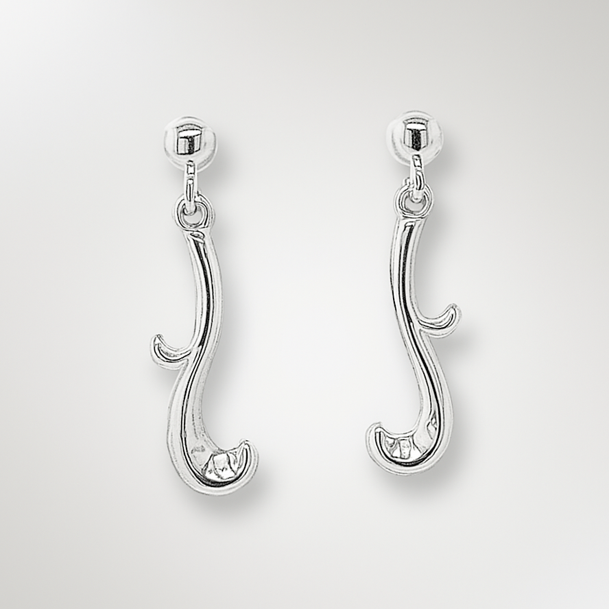 Pair of silver earrings on a light grey background