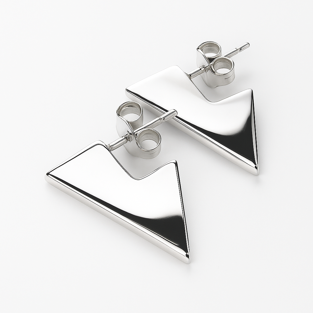 Pair of silver triangle earrings on a white background