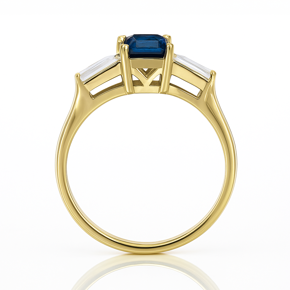 Gold ring with a blue gemstone on a white background