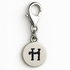 Silver charm with letter 'H' on a white background