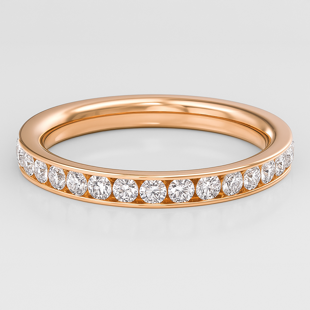 Rose gold ring with diamonds on a light gray background