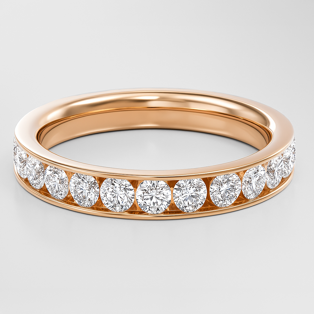 Rose gold ring with diamonds on a light gray background