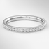 White Gold ring with small diamonds on a light gray background