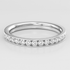 White Gold ring with small diamonds on a light gray background