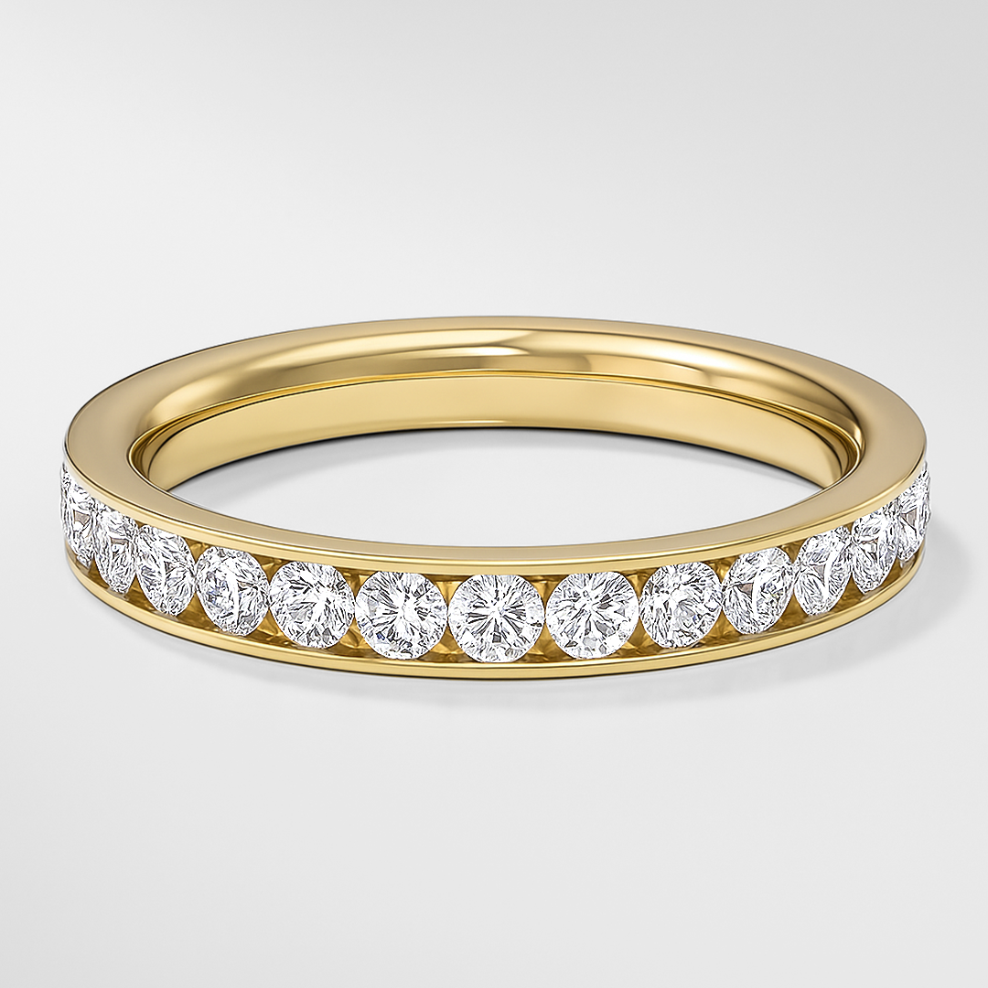 Gold ring with diamonds on a light gray background