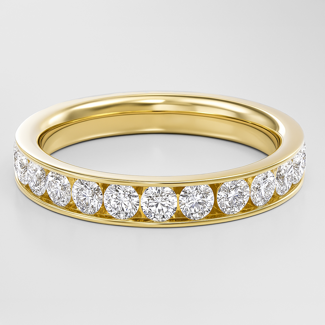 Gold ring with diamonds on a light gray background