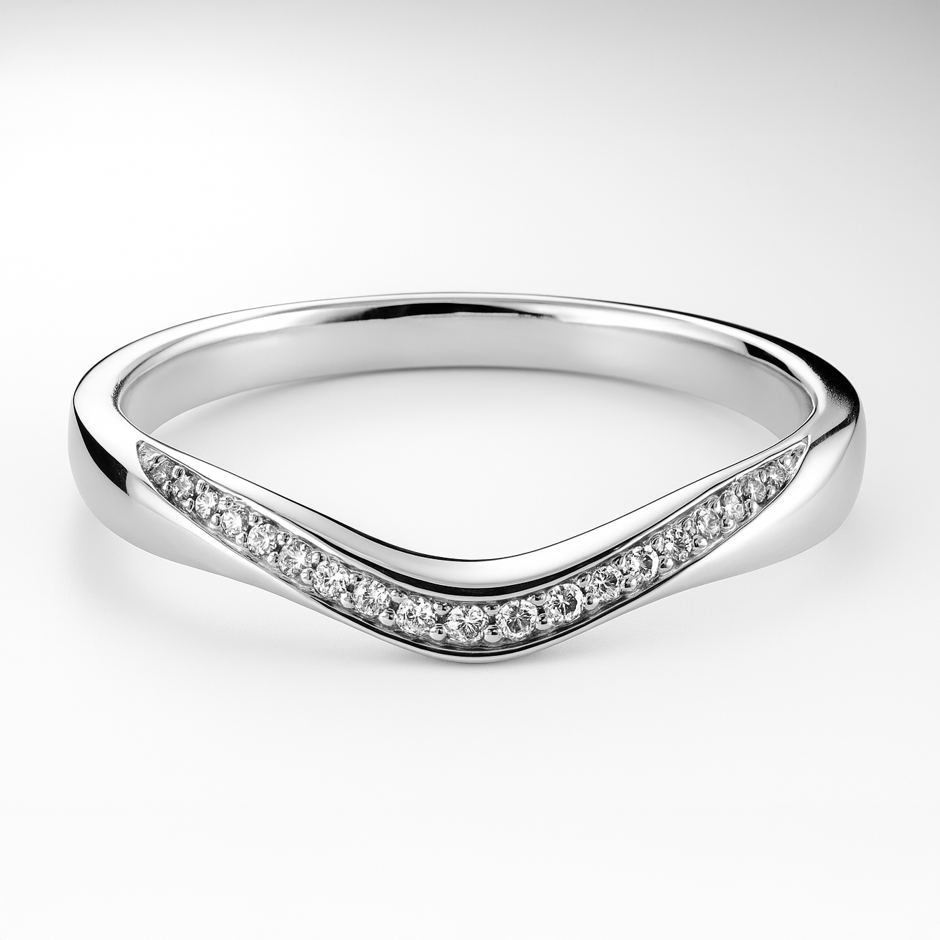 White gold ring with diamond accents on a light background