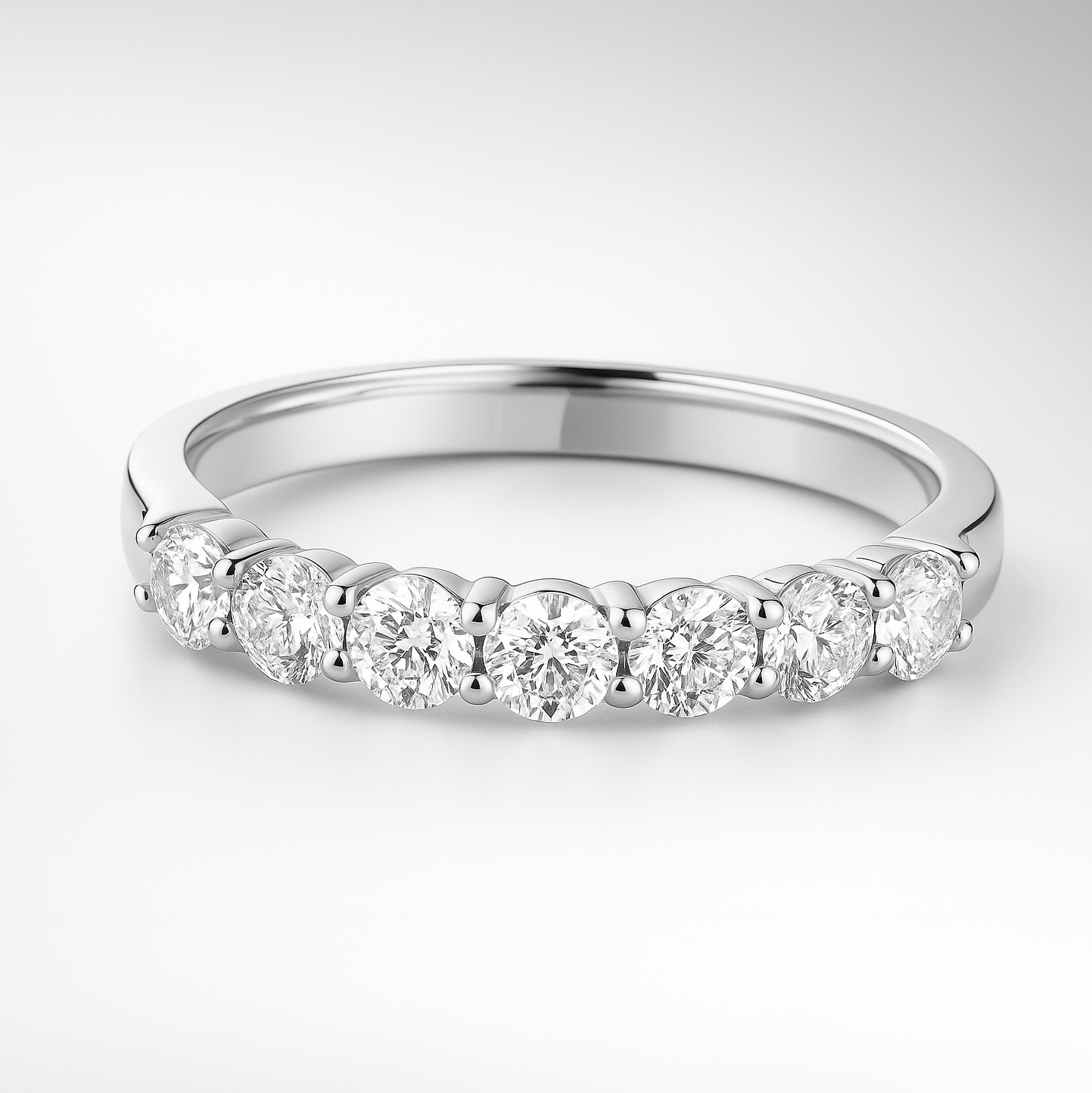 White gold wedding ring with diamonds on a white background