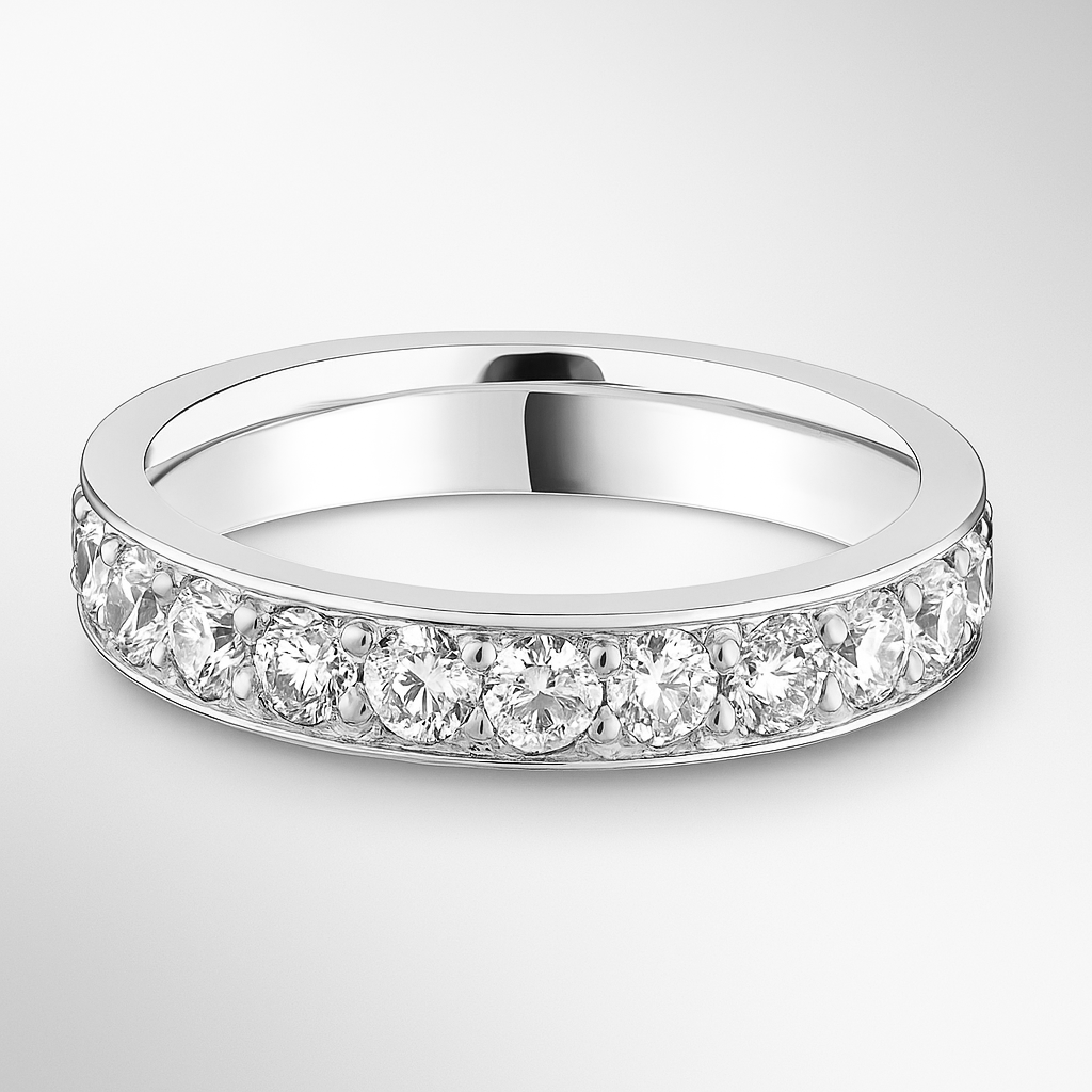 White gold wedding ring with small diamonds on a light grey background