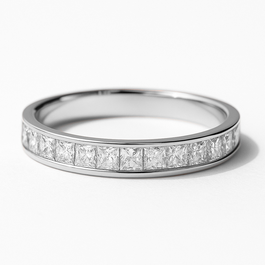 White Gold ring with princess-cut diamonds on a white background