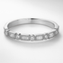 White Gold Diamond ring with baguette and round cut diamonds on a white background