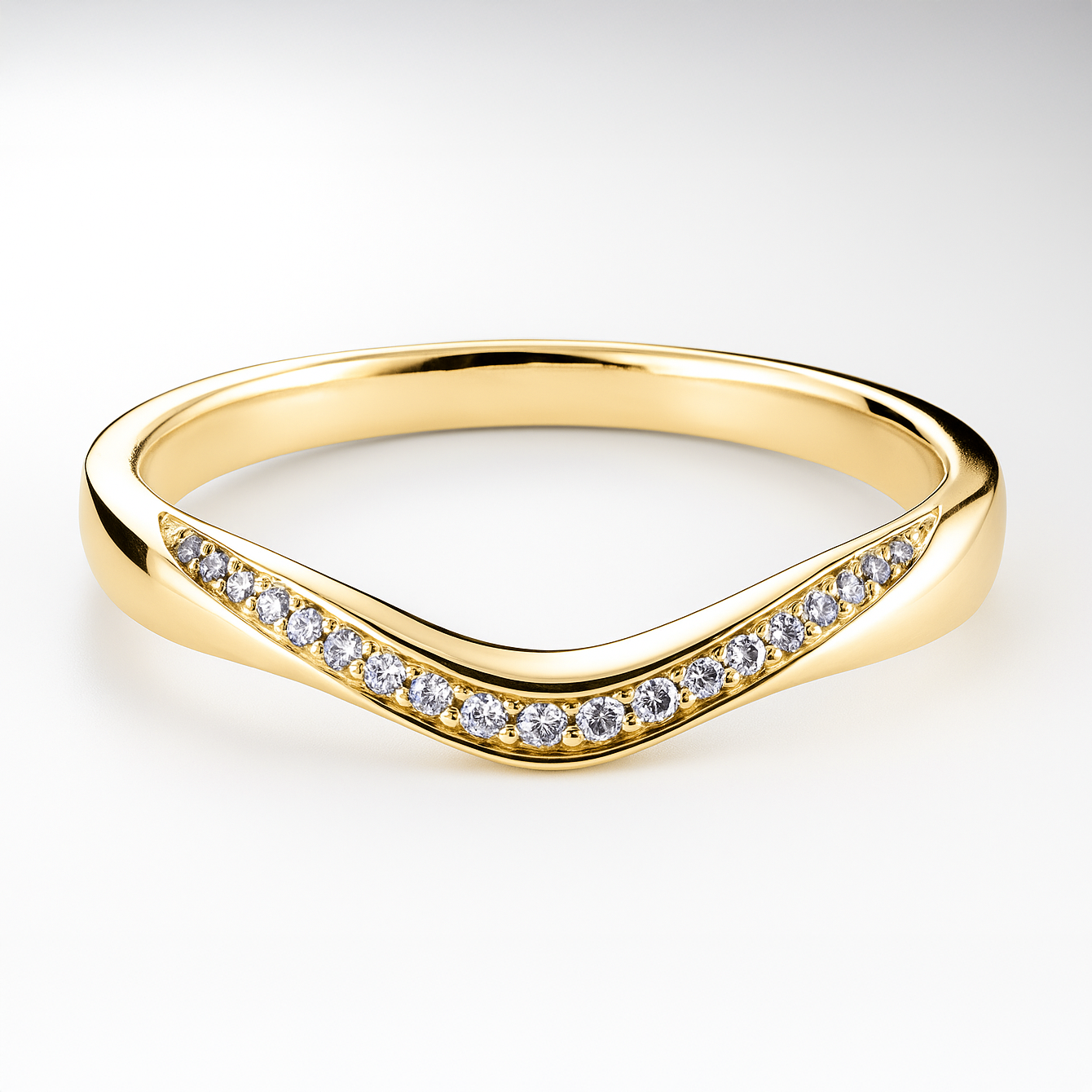 Yellow gold ring with diamond accents on a light background