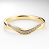 Yellow gold ring with diamond accents on a light background
