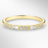 Yellow Gold Round and Baguette Diamond Ring on a White Background