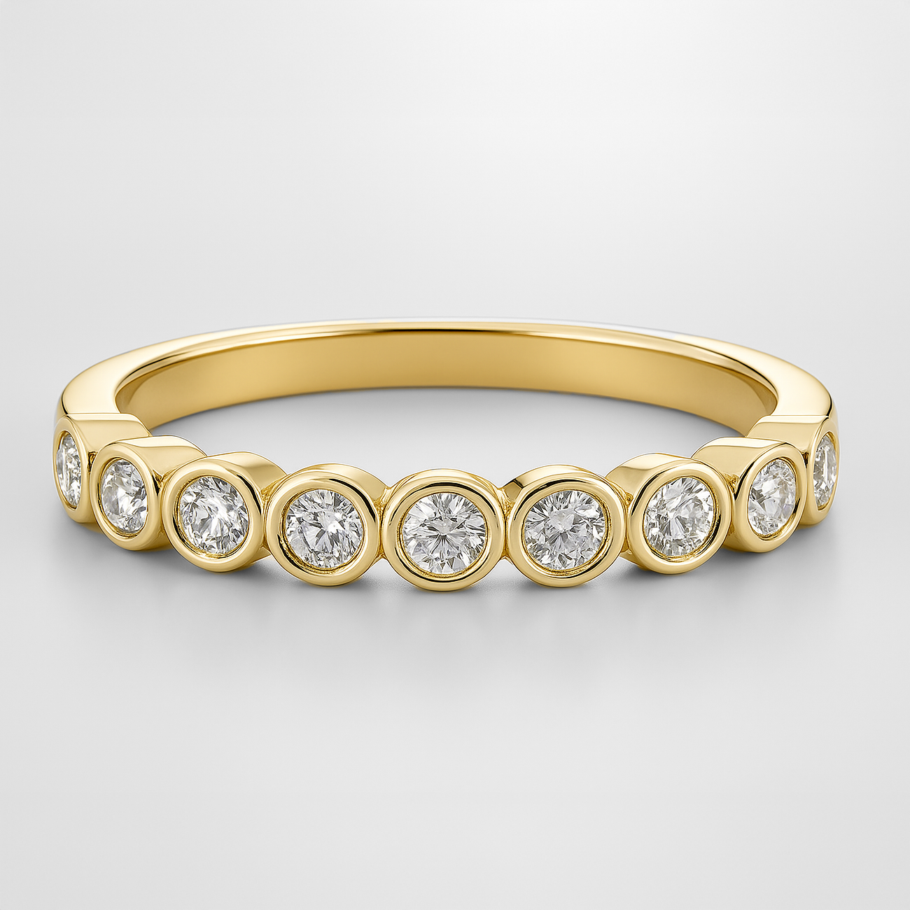 Yellow Gold Rubover Setting Diamond Wedding Ring on a White Background