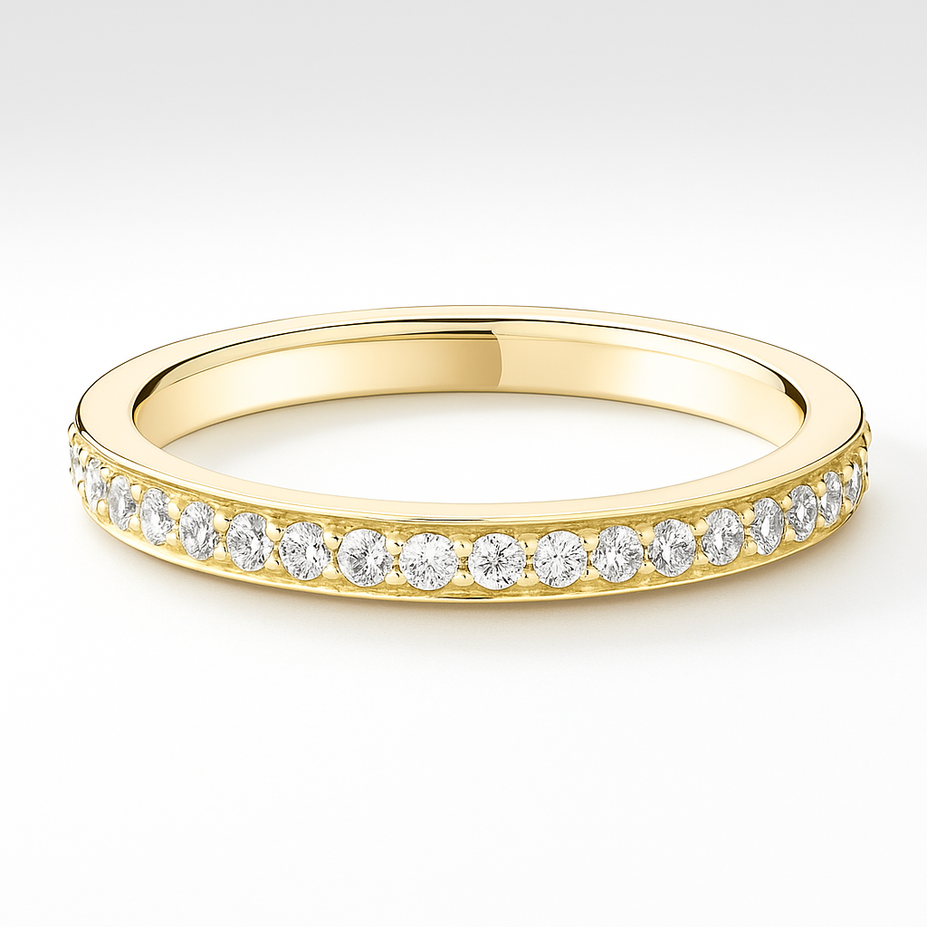 Gold wedding ring with small diamonds on a white background