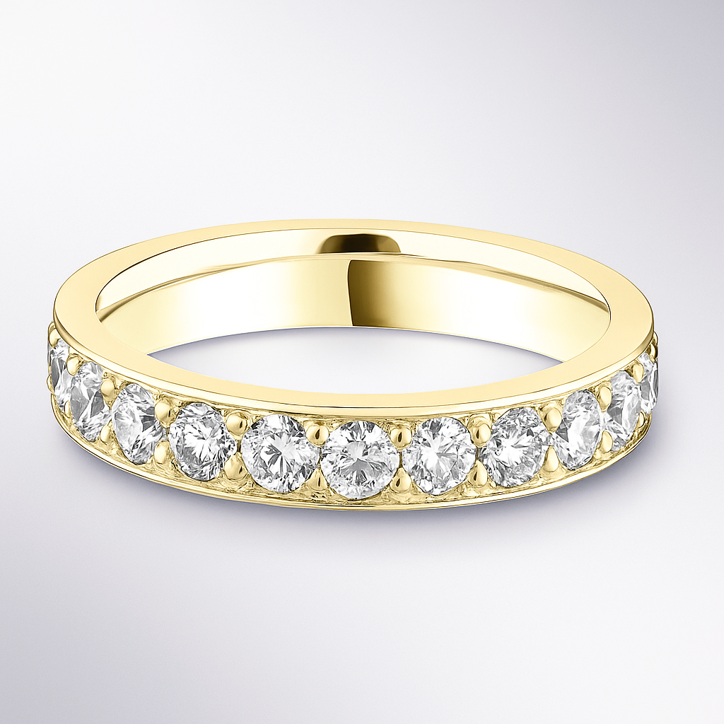 Gold wedding ring with embedded diamonds on a light grey background
