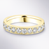 Gold wedding ring with embedded diamonds on a light grey background