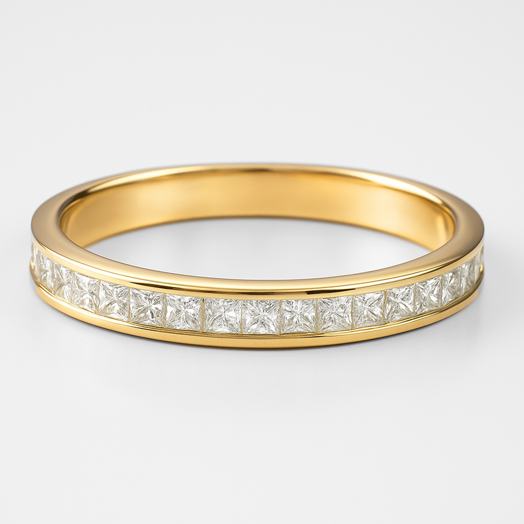 Gold ring with diamond stones on a light grey background