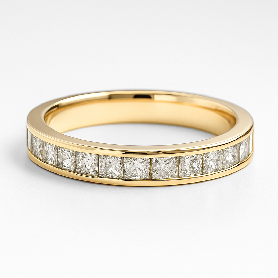 Gold ring with diamond stones on a white background